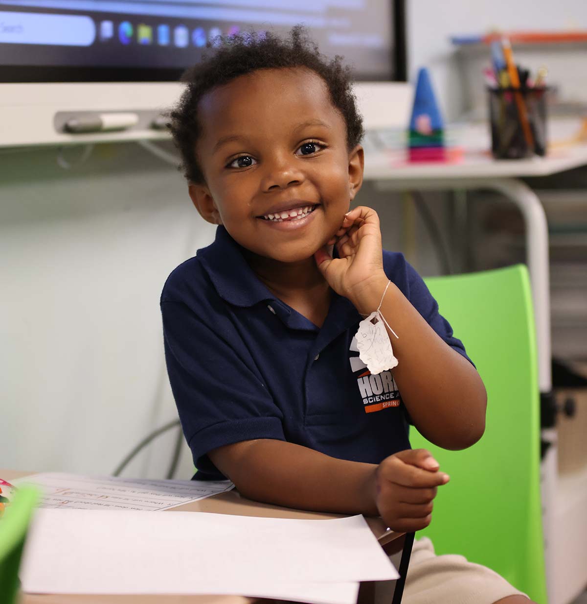Student drawing in a classroom.