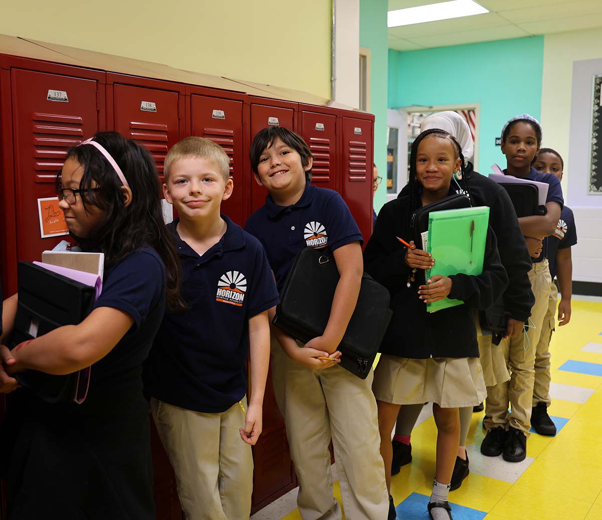 Teacher or school staff member warmly interacting with a student outside