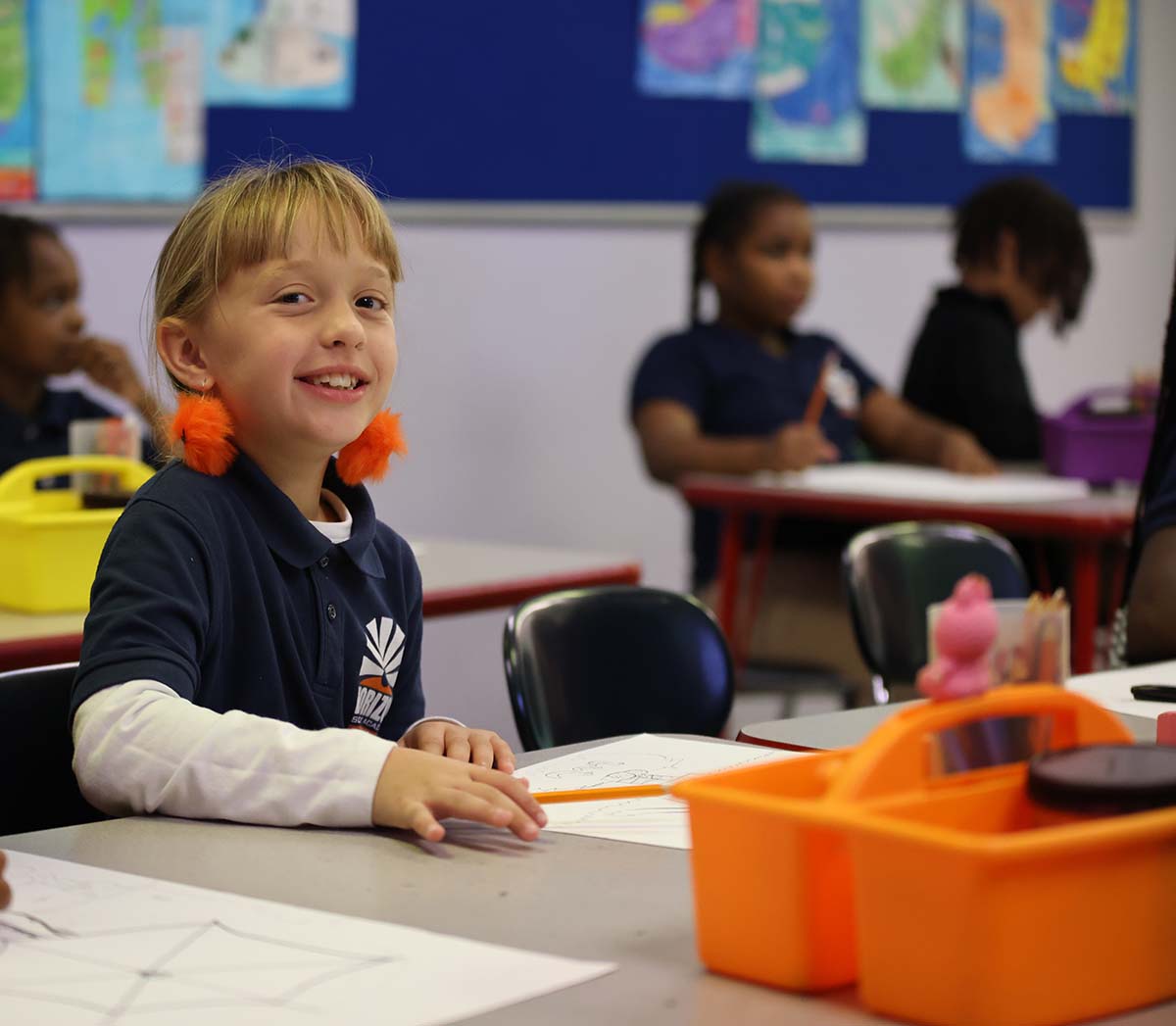 Smiling children together outdoors.